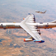 The JRB-36F with an RF-84K approaching the starboard wing station.